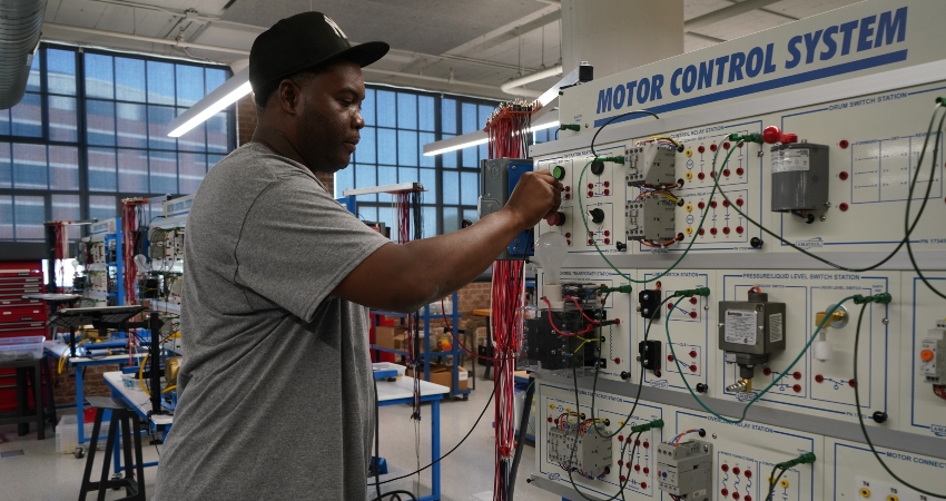 African American male working with a motor control system